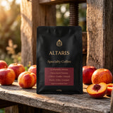 Altaris La Montaña 250g coffee bag on a weathered oak cider-press bench with apples and peaches